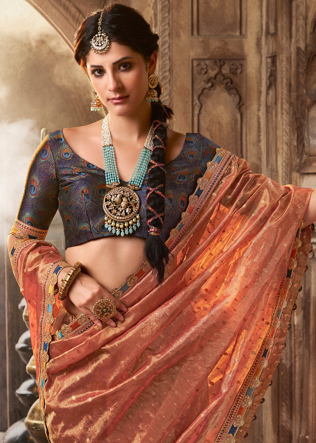 Faddism Kira Kavyasachi Melon Peach Pure Tissue Saree with Designer Blouse